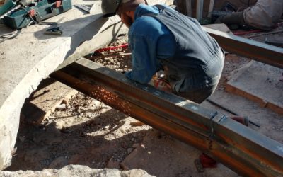 To create a serviceable area below our deck, we needed to install several I-Beams to support our decking. We excavated below our deck & removed the old material. At this point, we installed our I-Beams by welding and cutting them to shape. These were supported by hydraulic rams that are now permanently installed below our decking. This gives us complete access below our deck to access our plumbing and make repairs in the event of a breakage. Talk about some cost saving measures! This saves our customer from having to remove sections of decking to complete a repair for future events.