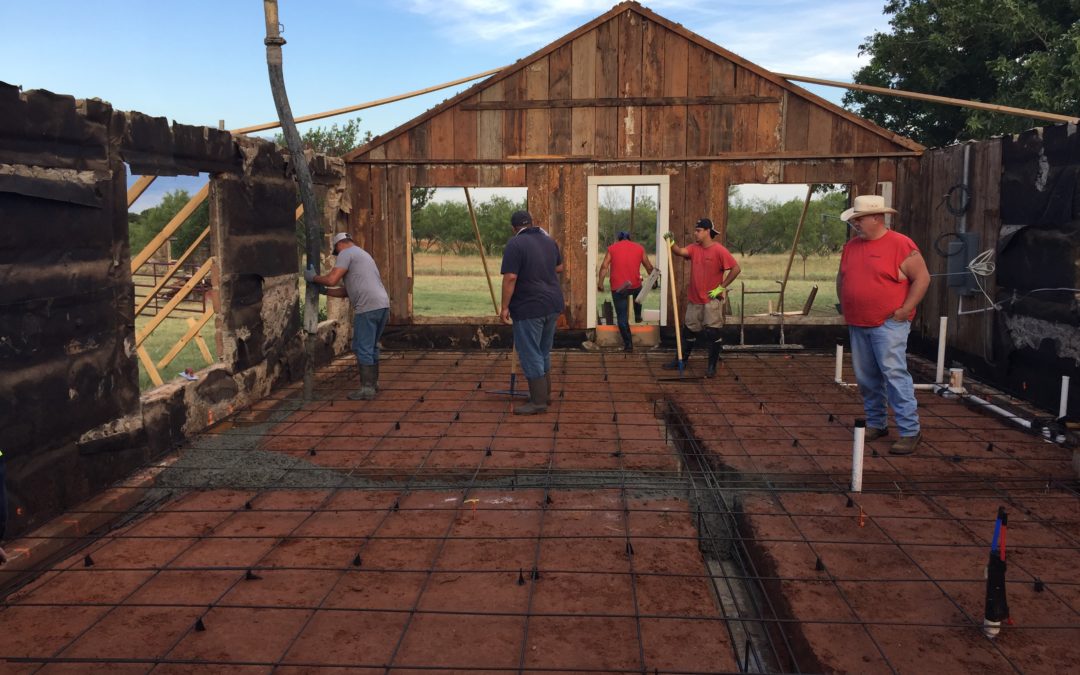 Part of our renovation process involves fixing the foundation and creating a whole new concrete slab for the base of the home Our crews are seen here framing our groundwork and pouring our concrete material. This is arduous work but paramount to the future health of the home.